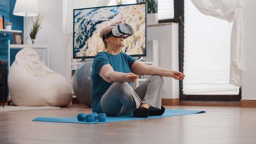 Retired woman playing fitness games in the metaverse.